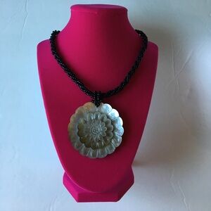 Bead necklace with flower shell pendent